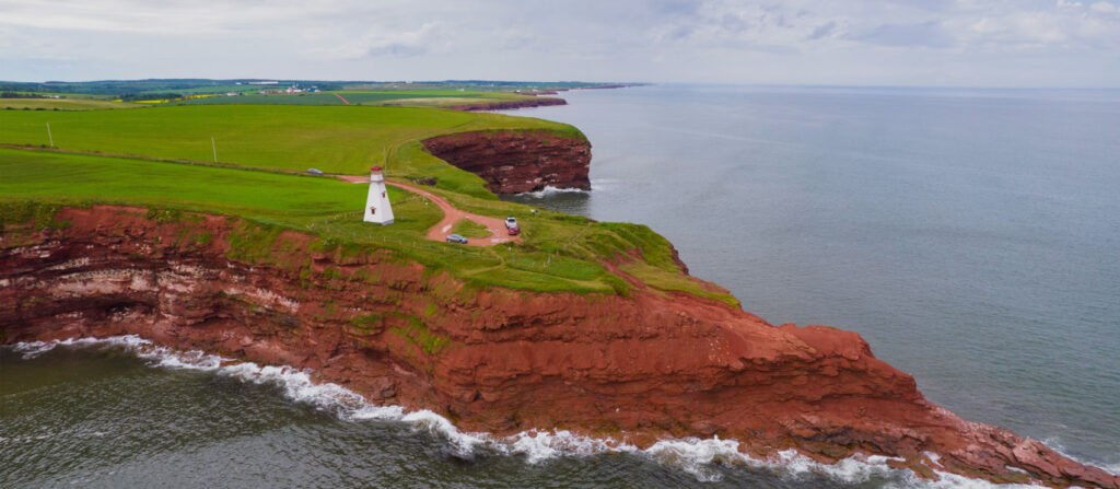 Lighthouse next to a cliff